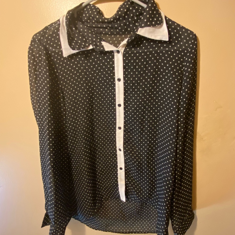 This is a medium sheer polka dot top to wear over something